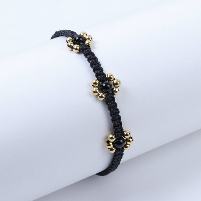 Pulsera Hilo Negro Flores Doradas con Negro